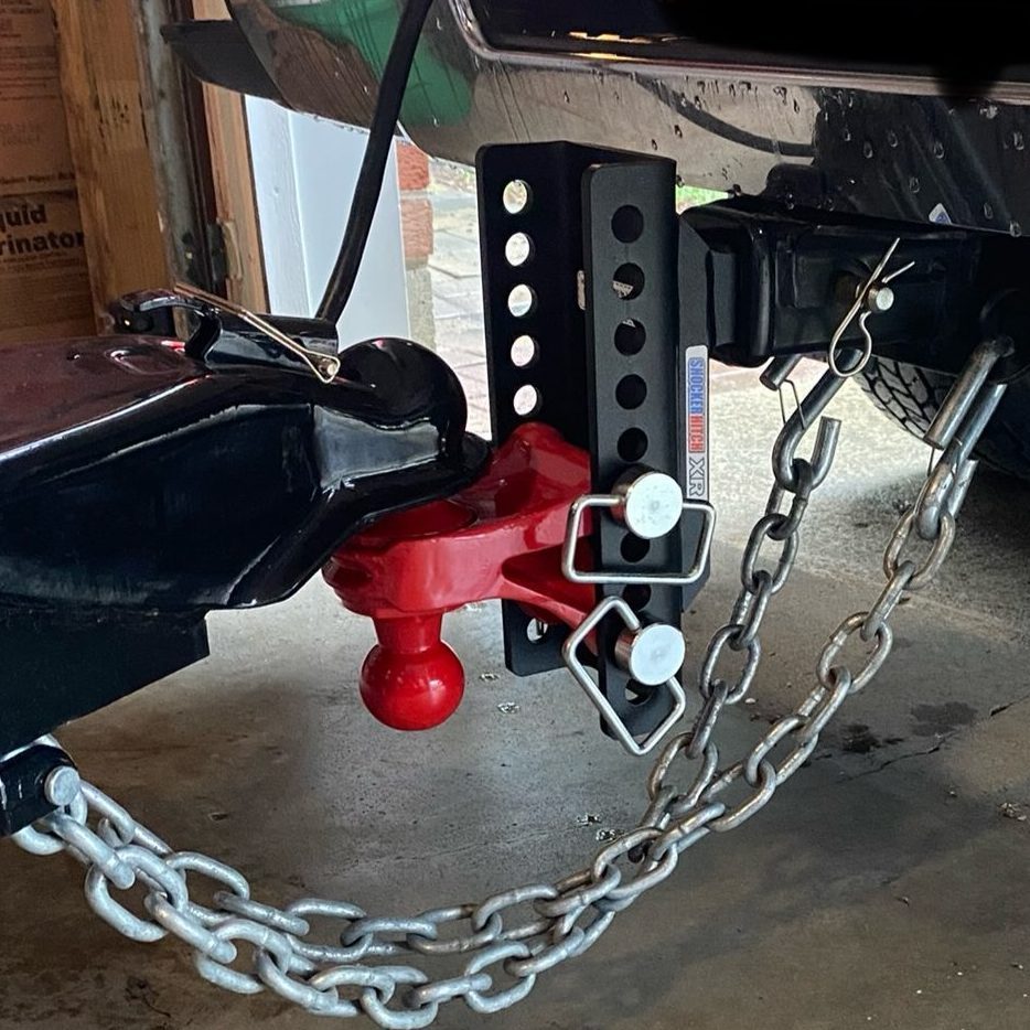 Receiver hitch and ball mount installed behind a tow vehicle