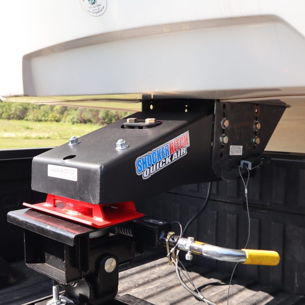 5th wheel camper pin box with kingpin connected to in-bed 5th wheel hitch.