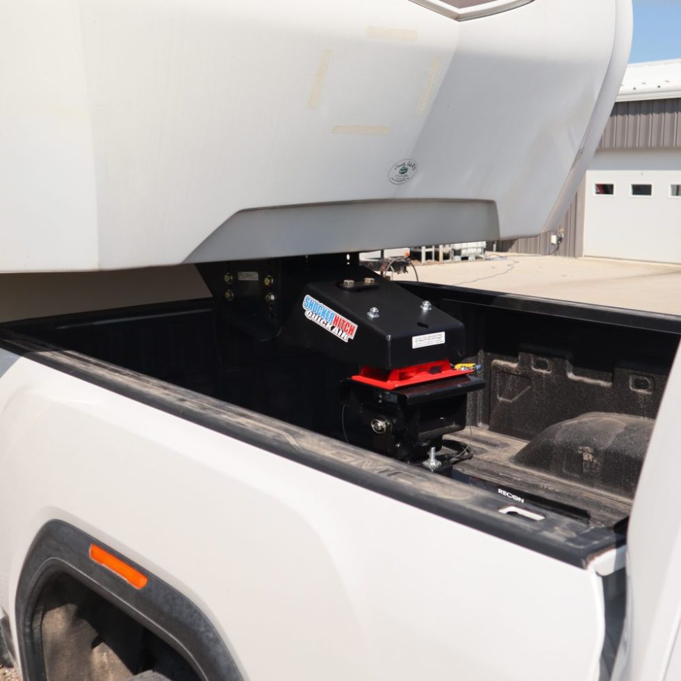 Fifth-wheel camper and truck showing the front pin-box area