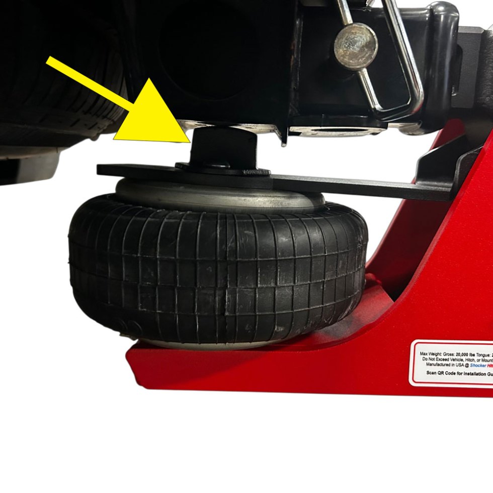 Correctly installed spacer block contacting the underside of a truck receiver tube