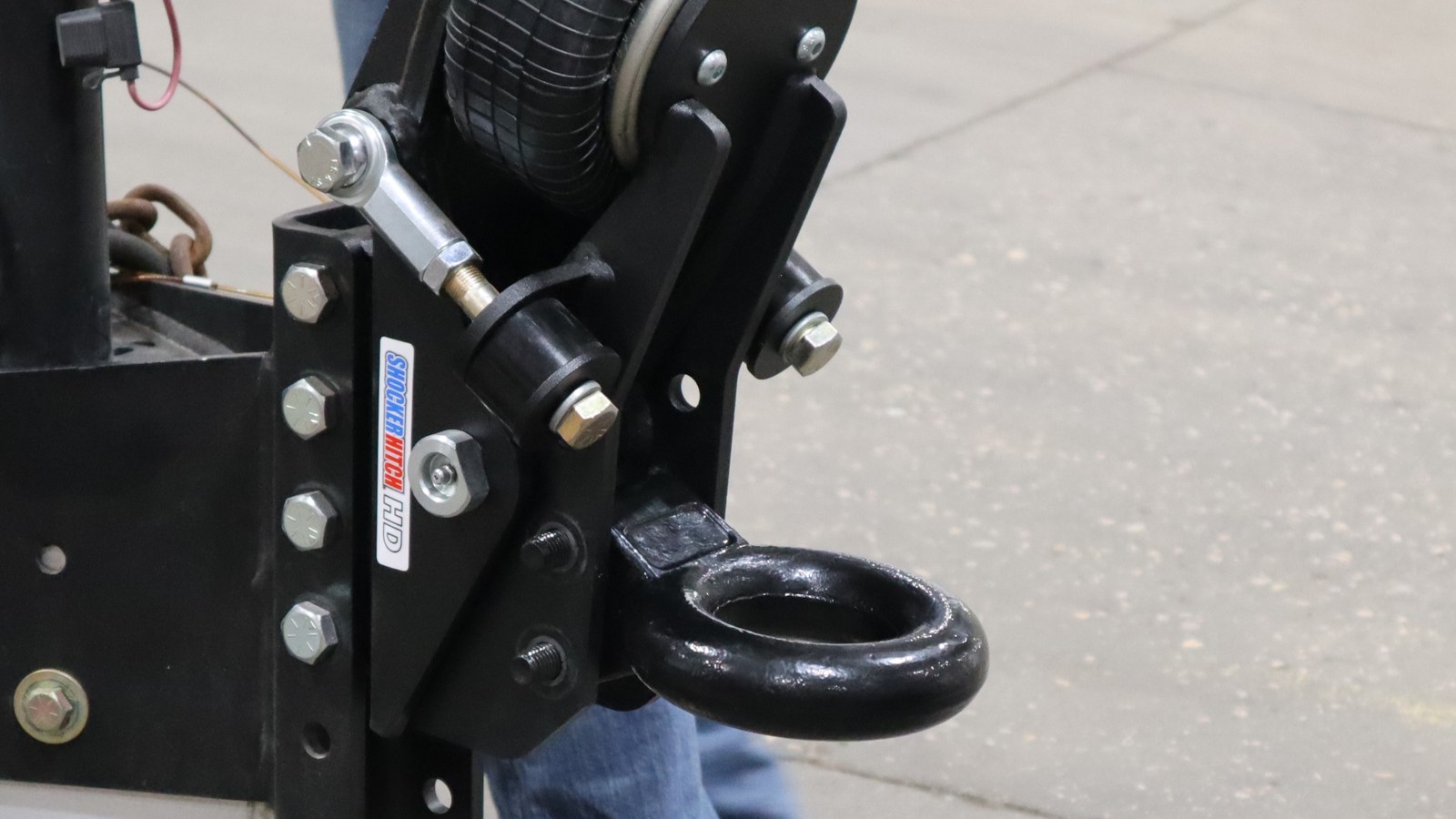 Pintle ring aligned in the lower attachment holes of a Shocker Air Tongue Mount