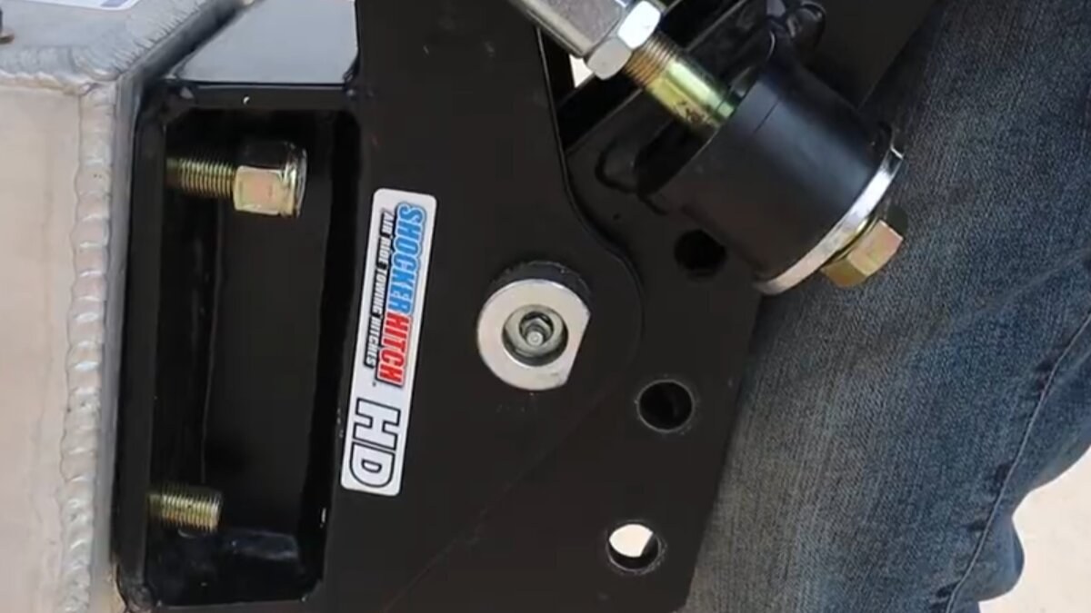 Shocker Air Tongue Mount seated against the trailer square plate with mounting nuts installed
