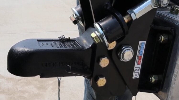 Wallace Forge ball coupler with three attachment bolts in a Shocker Air Tongue Mount