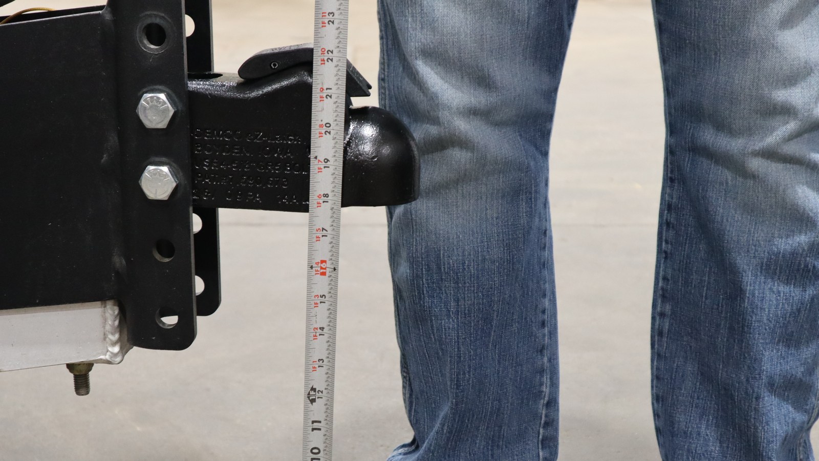 Tape measure beside the original trailer coupler showing its height above the ground