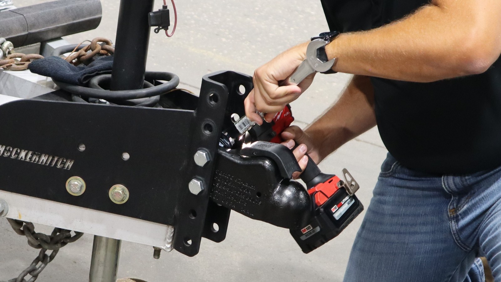 Removing a trailer coupler from the vertical channel with an impact driver