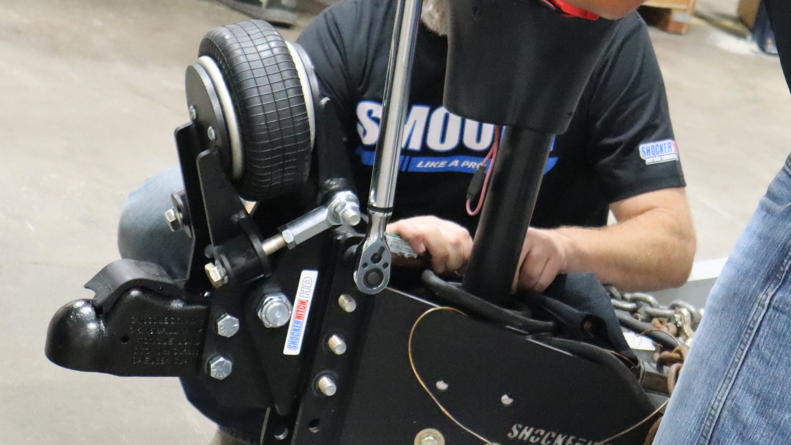 Installer using a torque wrench on the Air Tongue Mount vertical-channel mounting bolts