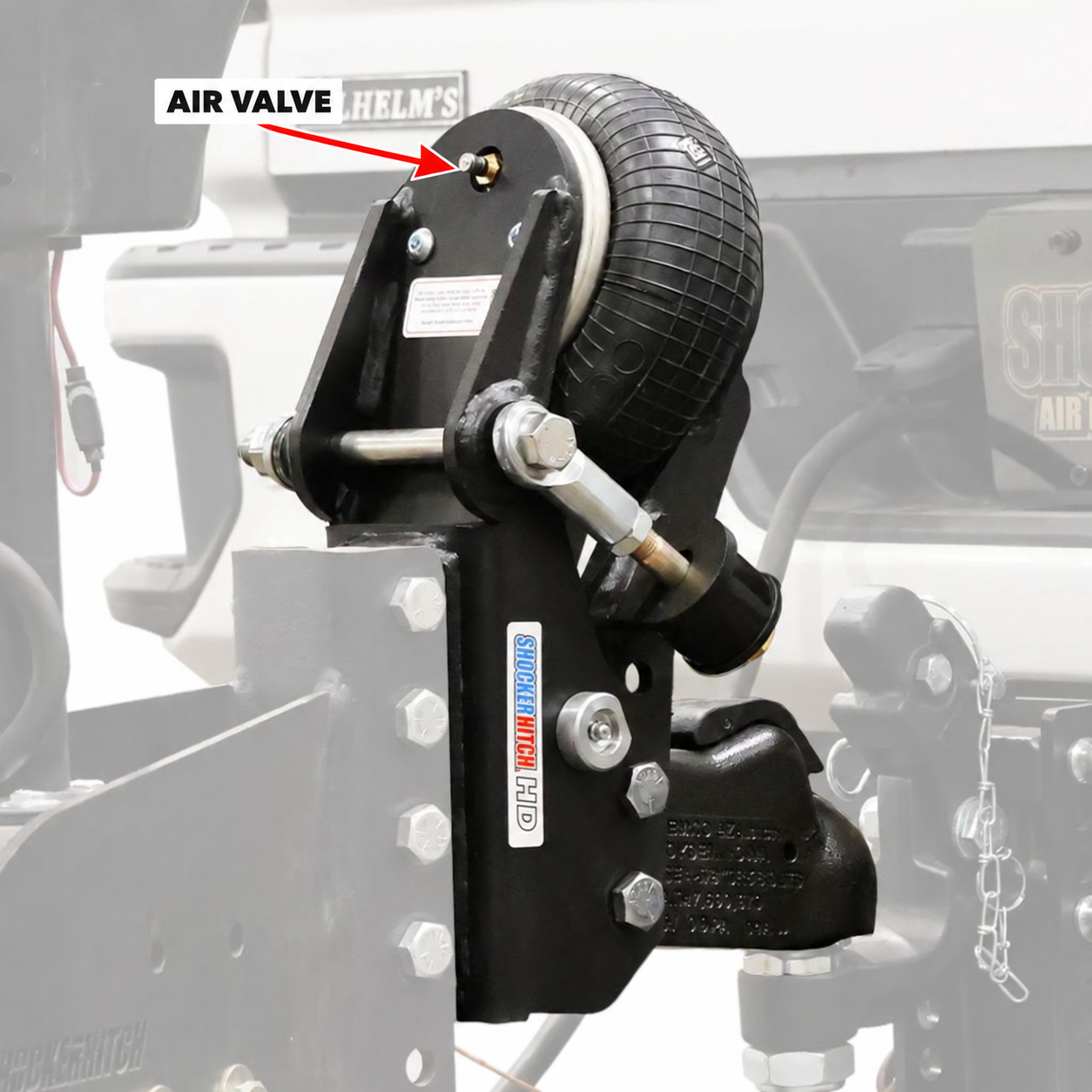 Arrow pointing to the air inflation valve on a Shocker HD trailer tongue mount